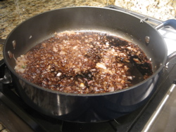 The shallots have softened up and I've added the balsamic vinegar. It will simmer until reduced.