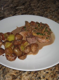 Pork tenderloin with Balsamic reduction and fig sauce and roasted red potatoes