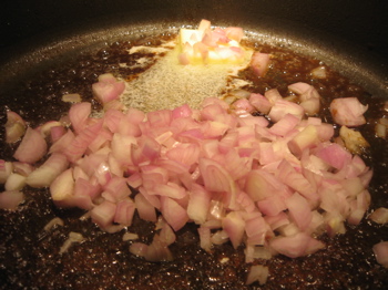 After beef stock evaporates, the shallots sautée in the butter. Smells good!