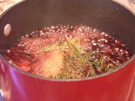 Tyler Florence's Rosemary Pomegranate glaze simmering on the stove.
