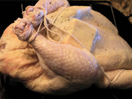 I decided to truss this chicken. I also added butter and rosemary under the skin.